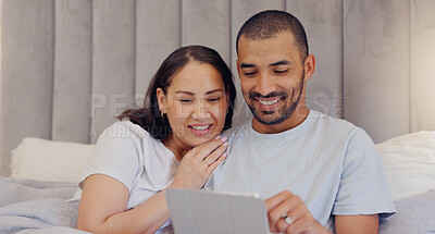 Buy stock photo Tablet, happy and young couple in bed watching a video on social media or the internet together at home. Smile, digital technology and man and woman relaxing and bonding in bedroom at modern house.