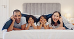 Portrait, happy and children with parents in bed relaxing and bonding together at family home. Smile, fun and young mother and father laying and resting with kids in bedroom of modern house.