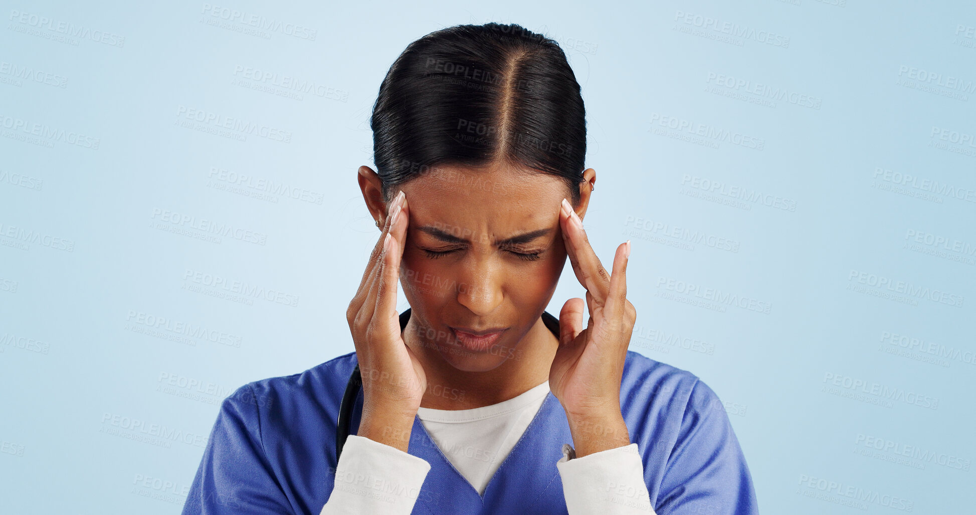 Buy stock photo Doctor, studio or woman with headache, emergency or fatigue in medical healthcare crisis or head pain. Depression, face or tired nurse with burnout, migraine or stress isolated on blue background 