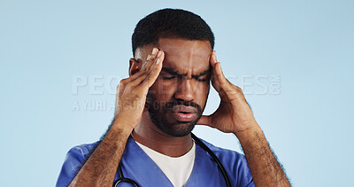 Buy stock photo Doctor, dizzy or man in studio with headache, head pain or fatigue in medical healthcare crisis or emergency. Depression, face or tired male nurse with burnout, migraine or stress on blue background