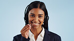 Happy woman, portrait and headphones for call center or customer service against a blue studio background. Face of female person, consultant or agent smile with mic for online advice on mockup space