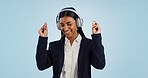 Headphones, dancing or happy businesswoman in studio for music isolated on blue background. Energy, smile or calm female person streaming a radio song, sound or audio on online subscription to relax