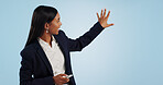 Business woman, presentation and reporter in advertising against a blue studio background. Female person or employee speaking, teaching or showing information or consulting data on mockup space