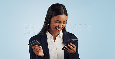 Excited business woman, phone and credit card for payment or online shopping against a blue studio background. Happy female person smile with mobile smartphone for banking or transaction on mockup