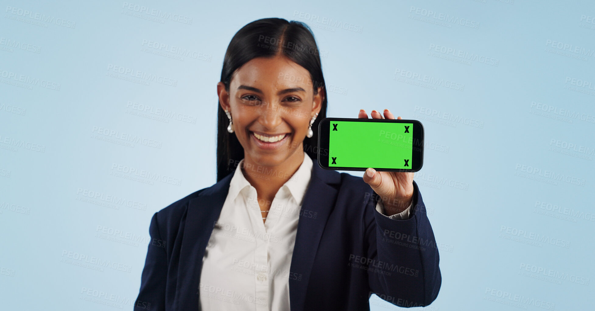 Buy stock photo Happy business woman, phone and green screen for advertising against a blue studio background. Portrait of female person or employee smile showing mobile smartphone display, chromakey or mockup space