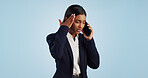 Business, phone call and woman with stress, headache and employee isolated on a blue studio background. Mockup space, person and entrepreneur with a cellphone, connection and frustrated with migraine