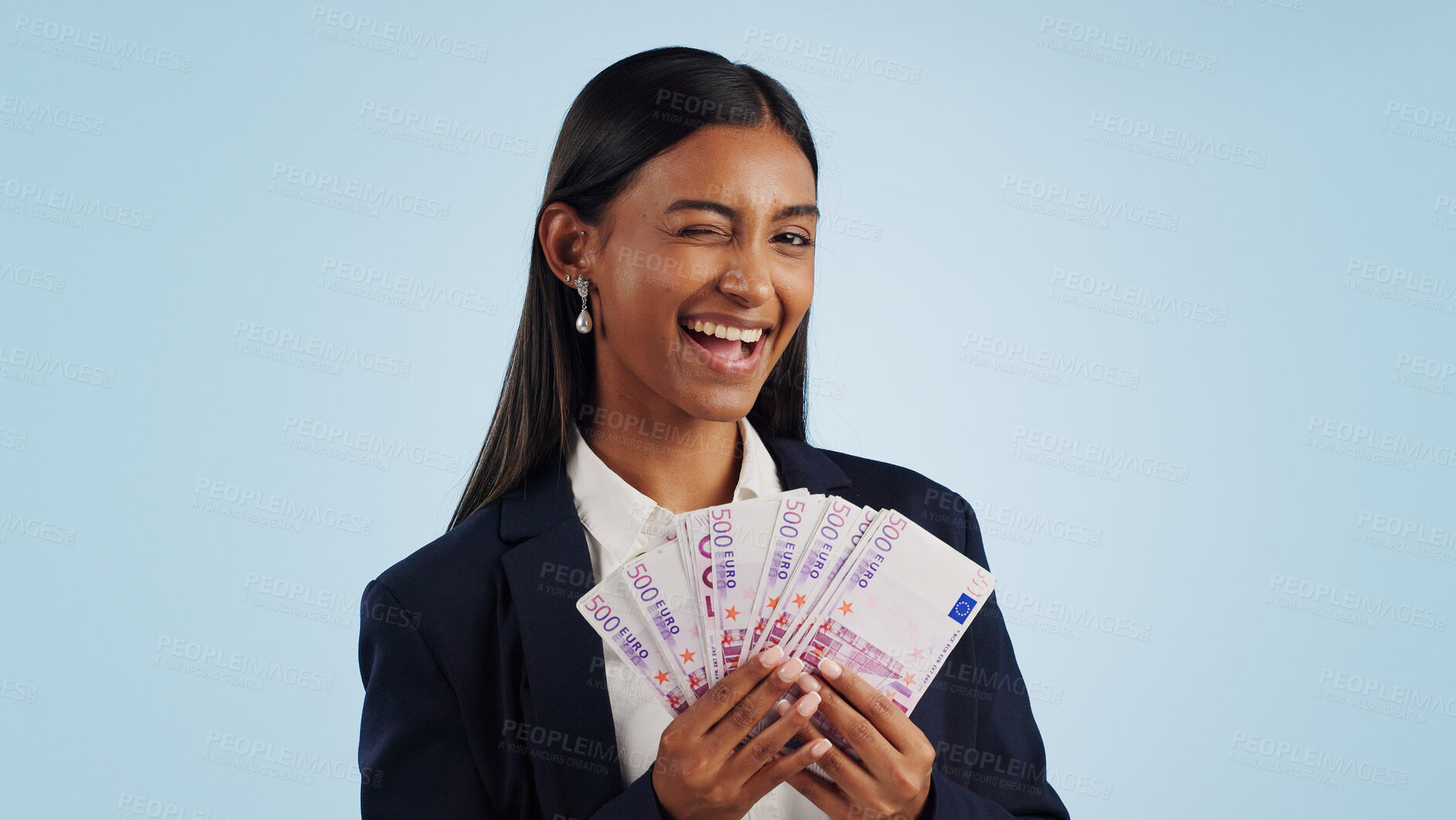 Buy stock photo Business woman, portrait and wink with money fan in financial freedom against a blue studio background. Female person or employee with cash, savings or investment for bonus salary on mockup space