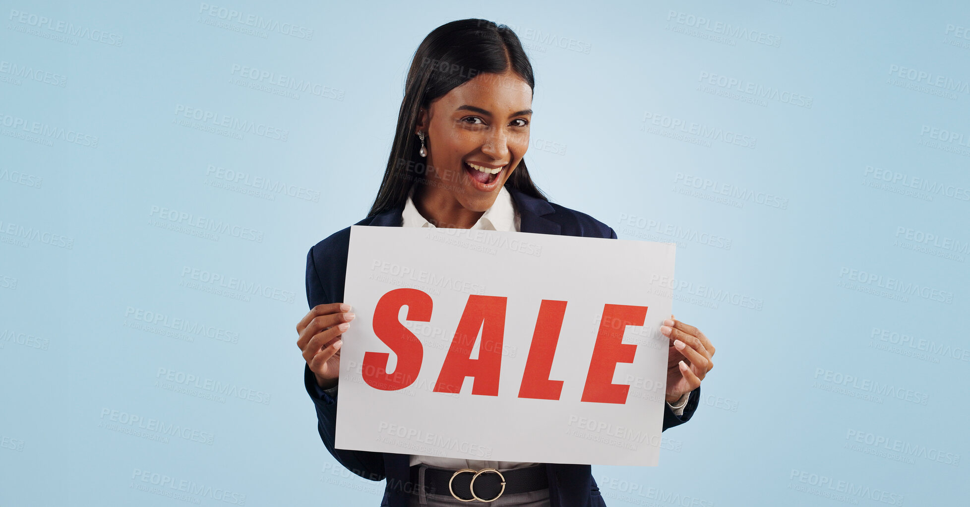 Buy stock photo Happy woman, portrait and sale sign for discount, advertising or deal against a blue studio background. Excited female person with billboard or poster for marketing, promo or special on mockup space