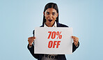 Happy woman, portrait and sale sign for advertising, discount or deal against a blue studio background. Female person with billboard or poster for marketing, promotion or special on mockup space