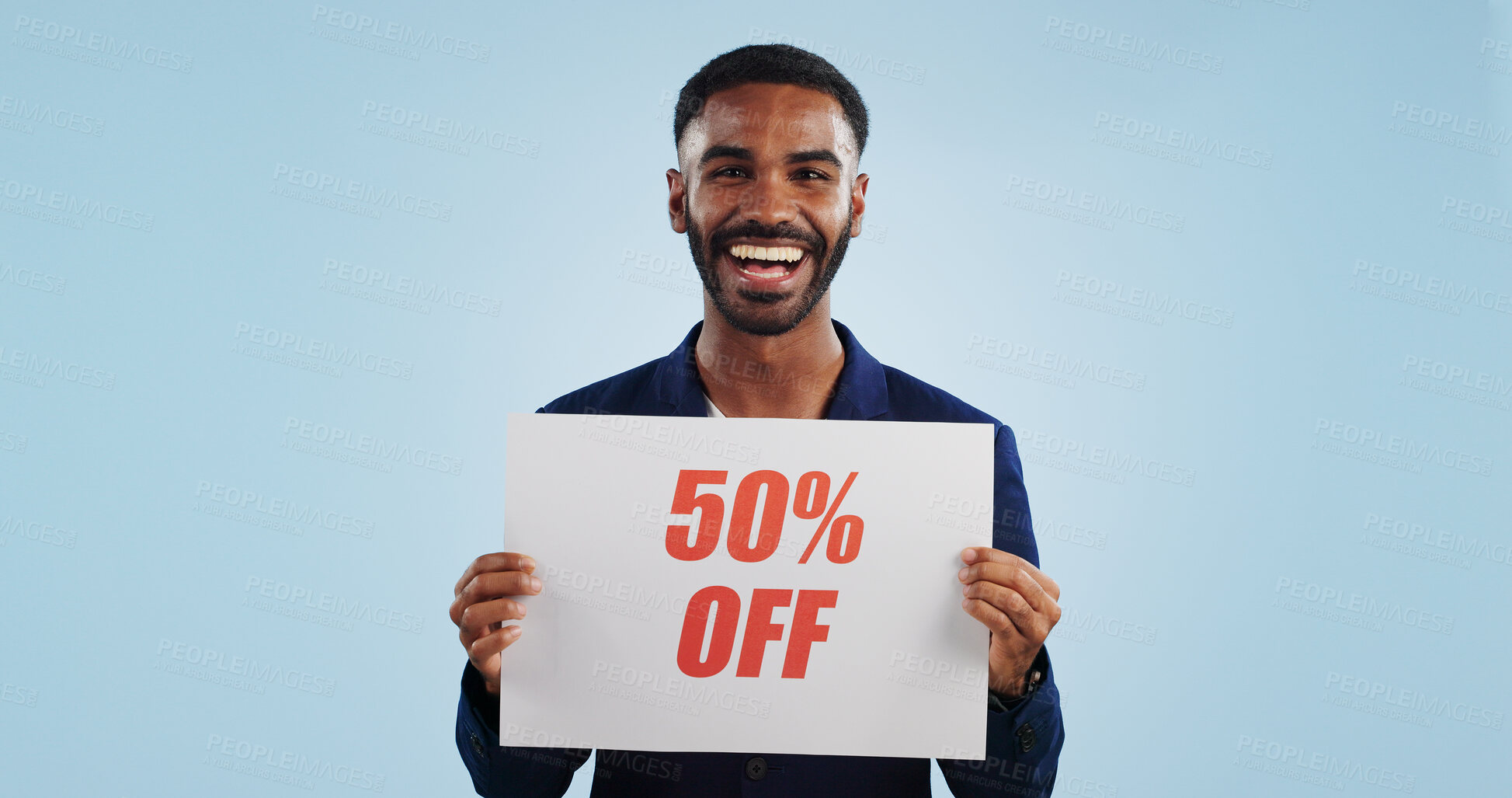 Buy stock photo Excited man, portrait and sale sign for advertising, deal or discount against a blue studio background. Happy male person showing billboard or poster for marketing, promotion or special on mockup