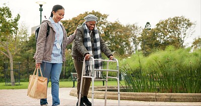 Nurse, support and walker with old woman in park for helping, person with a disability and retirement. Elderly care, nursing and rehabilitation with caregiver and patient in nature for healthcare