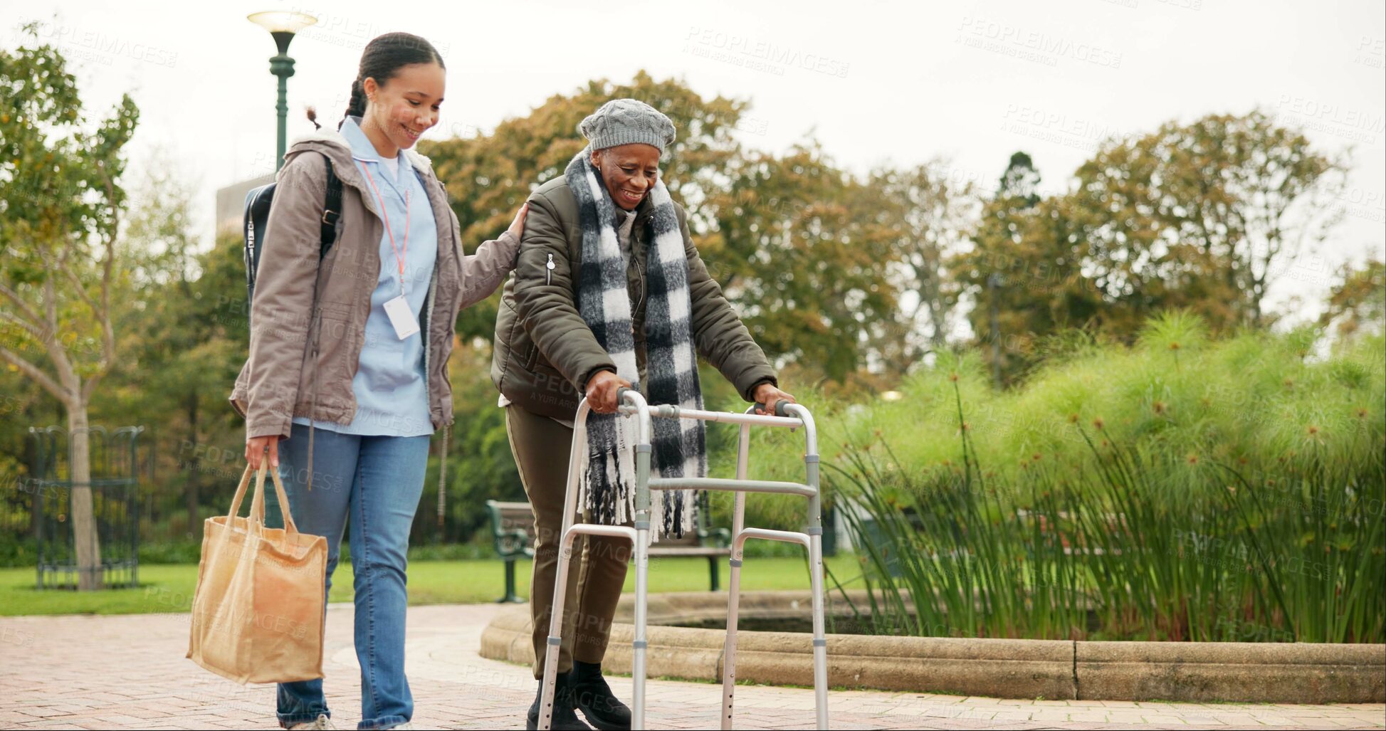 Buy stock photo Nurse, support and walker with old woman in park for helping, person with a disability and retirement. Elderly care, nursing and rehabilitation with caregiver and patient in nature for healthcare