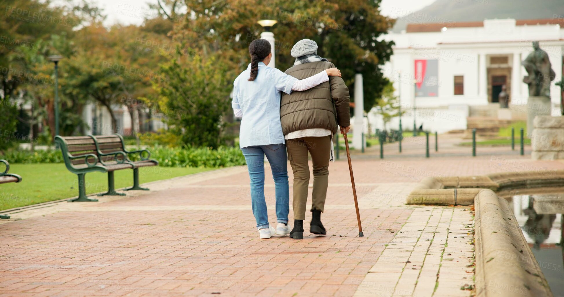 Buy stock photo Nurse, relax and park with old woman and walking stick for retirement, elderly care and physical therapy. Trust, medical and healthcare with senior patient and caregiver in nature for rehabilitation