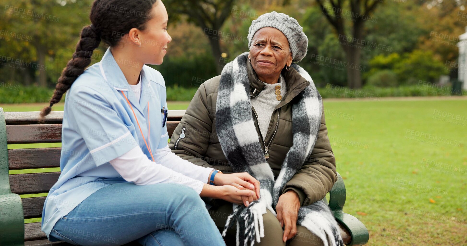 Buy stock photo Nurse, happy and relax with old woman on park bench for retirement, elderly care and conversation. Trust, medical and healthcare with senior patient and caregiver in nature for nursing rehabilitation