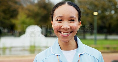 Professional nurse woman, outdoor and face with smile, young and excited for medical career in Toronto. Doctor lady, park and nature for walk, wellness and healthcare in summer sunshine in portrait