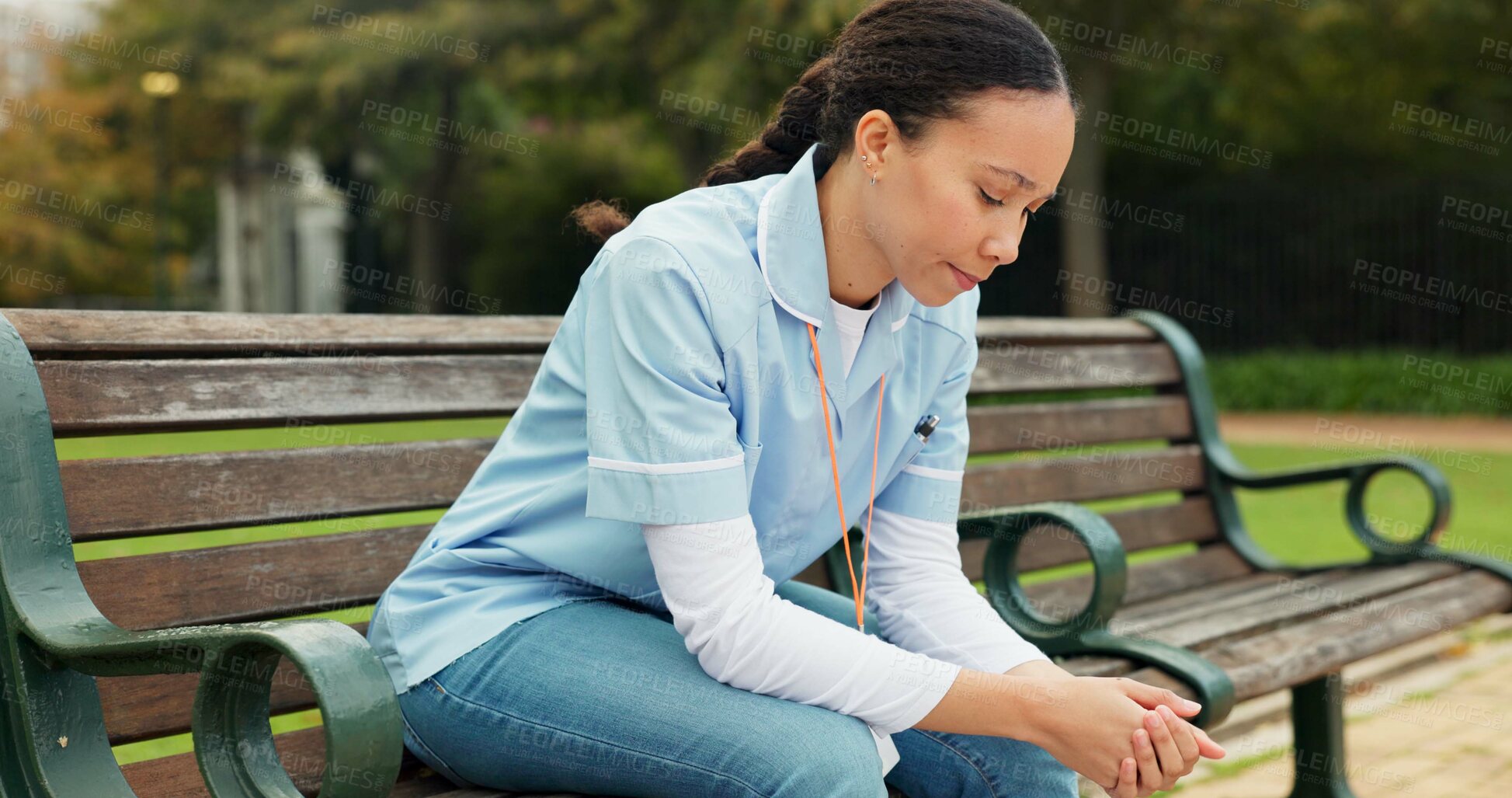 Buy stock photo Sad, tired and nurse with woman on park bench for thinking, fatigue and burnout. Mental health, anxiety and depression with female person in nature for frustrated, exhausted and healthcare problem