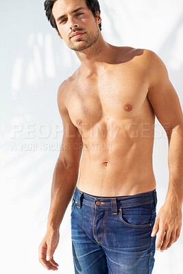 Buy stock photo Portrait, fashion and body with a young man outdoor on a white background for masculine style. Summer, shirtless and the muscles of a confident young model in a denim jeans for health or fitness