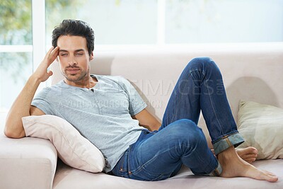 Buy stock photo Thinking, depression and man on a sofa with stress, anxiety or broken heart in his home. Sad, crisis or male person in living room overthinking, disaster or lonely, worried or disappointed in a house