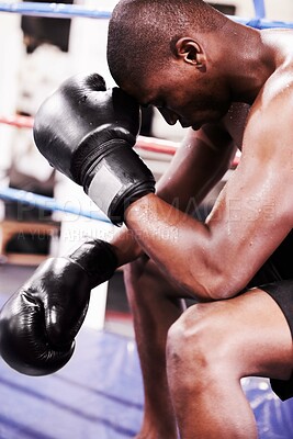 Buy stock photo Man, boxer and face down in boxing ring, sweat and gloves for workout, fighter and strong. Exercise, sports and train for power, self defense and concentration for challenge, mma and fighting skills
