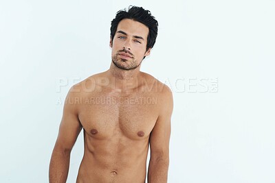 Buy stock photo Portrait, body and muscle with a sexy man in studio on a white background for masculine desire. Shirtless, tattoo and manly with a handsome young male model posing topless for rugged sensuality