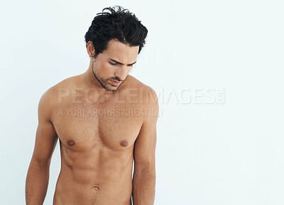 Buy stock photo Shirtless, fitness and man standing and thinking isolated on a white background for health, wellness or body depression. Sad, training and thoughtful model or person with abs and tattoo in studio