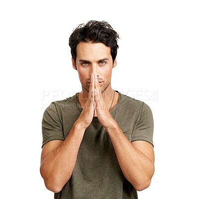 Buy stock photo Portrait, prayer and hands together with a young man in studio isolated on a white background for hope or faith. Face, trust and worship with a confident model praying to god in faith for a miracle