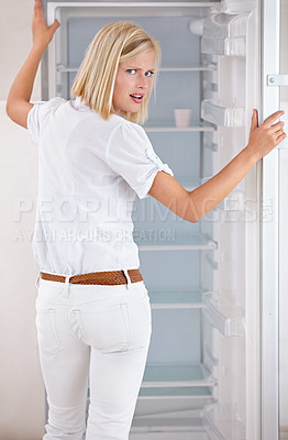 Buy stock photo Woman, shocked and empty fridge or food hungry or poor for meal, upset or frustrated in kitchen. Female person, portrait and concern starving cooking or appliance storage angry, sad or eating fail