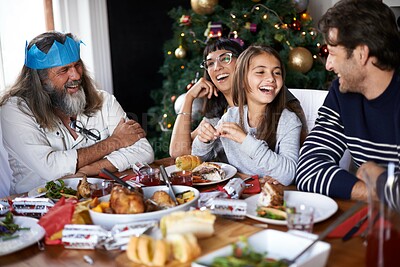 Buy stock photo Shot of a family celebrating christmas around a feast