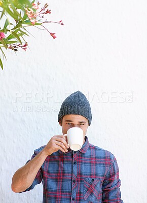 Buy stock photo Cropped portrait of a handsome young hipster drinking some coffee