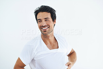 Buy stock photo Thinking, smile and a young man dressing in studio isolated on white background at the start of his morning. Idea, vision and getting ready with a happy person in a tshirt or casual clothing outfit 