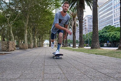 Buy stock photo Shot of skateboarders in the city