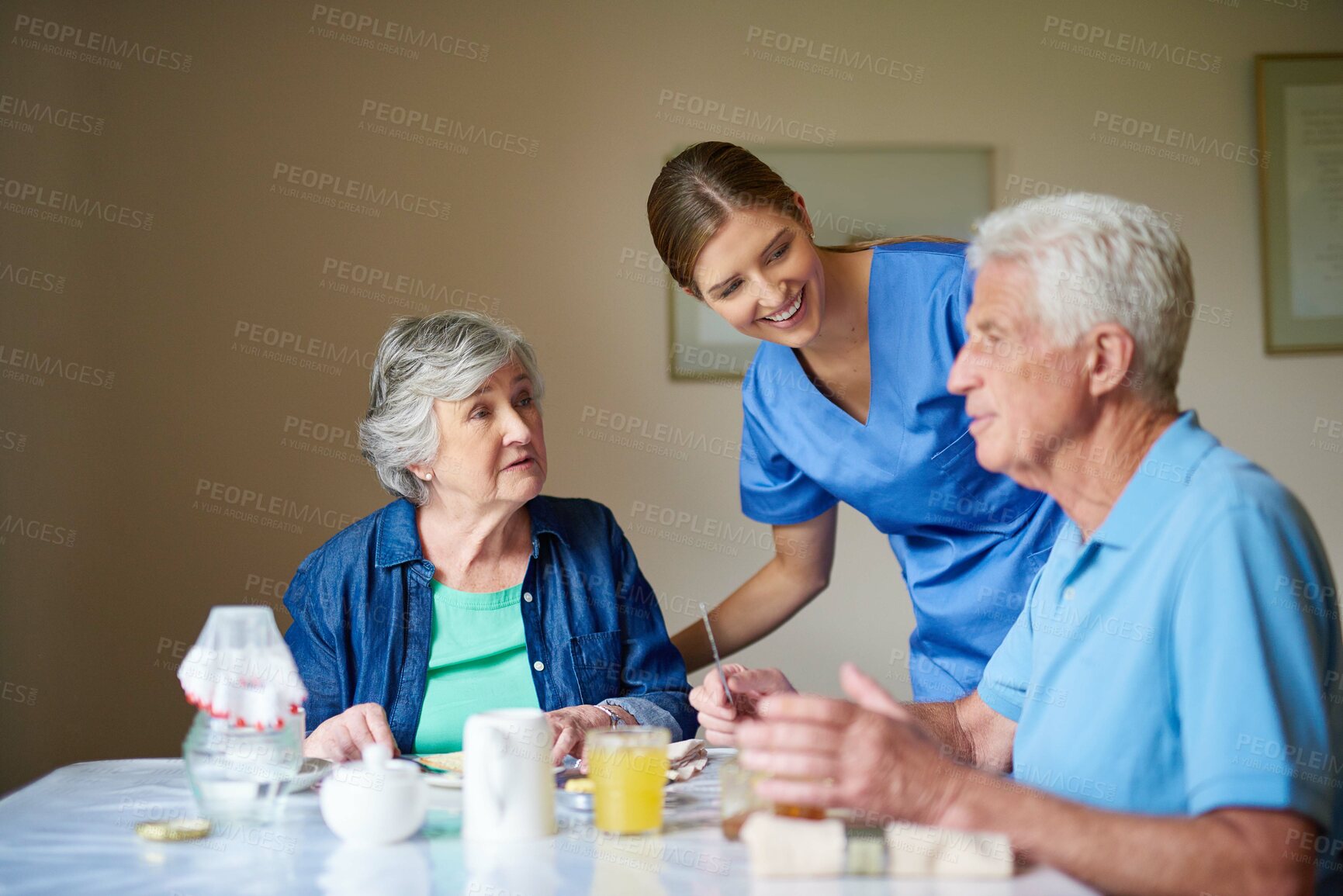 Buy stock photo Shot of two residents and a nurse at a retirement home