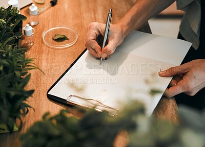 Buy stock photo Cropped shot of an unrecognizable botanist drawing botanical illustrations inside her office