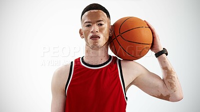 Buy stock photo Cropped portrait of a handsome young male basketball player posing in studio