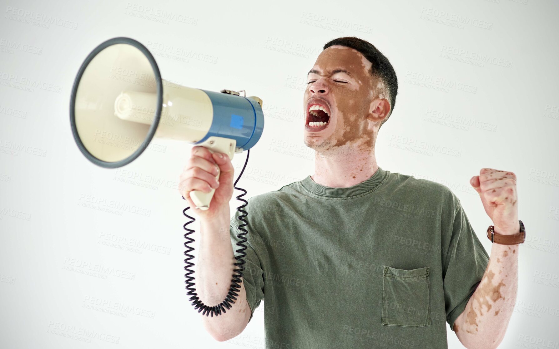 Buy stock photo Studio portrait of a young man pointing to copyspace against a white background