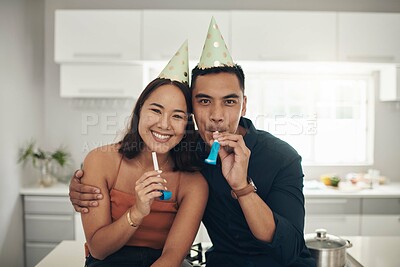 Buy stock photo Happy, birthday celebration and portrait of a couple with party hats in a kitchen. Love, care and Asian woman with a man together in a home with happiness to celebrate holiday in a house on date