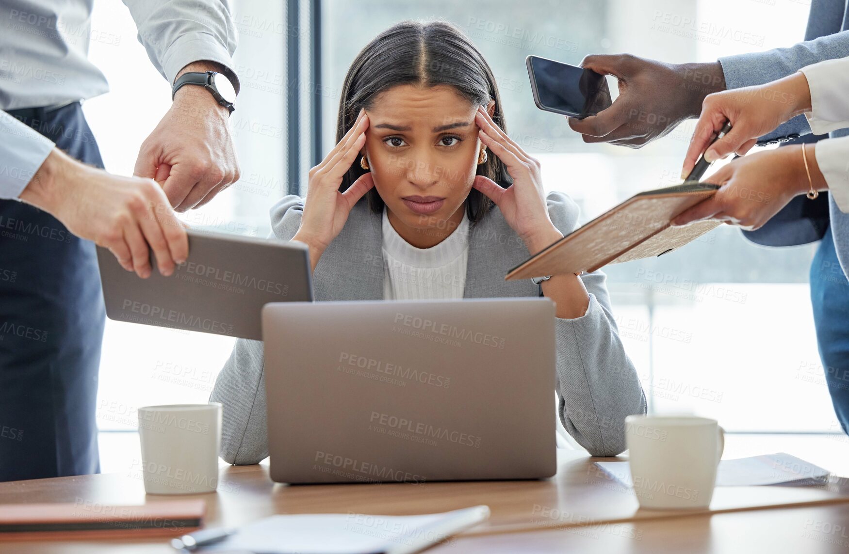 Buy stock photo Shot of a young businesswoman feeling stressed out in a demanding office environment at work