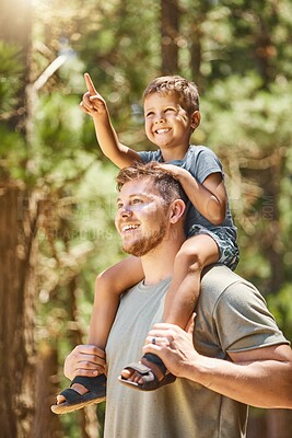 Buy stock photo Hiking, family and a boy pointing with his dad while sitting on his shoulders outdoor in the forest or woods. Kids, love or adventure with a son and his father in the wilderness to explore nature
