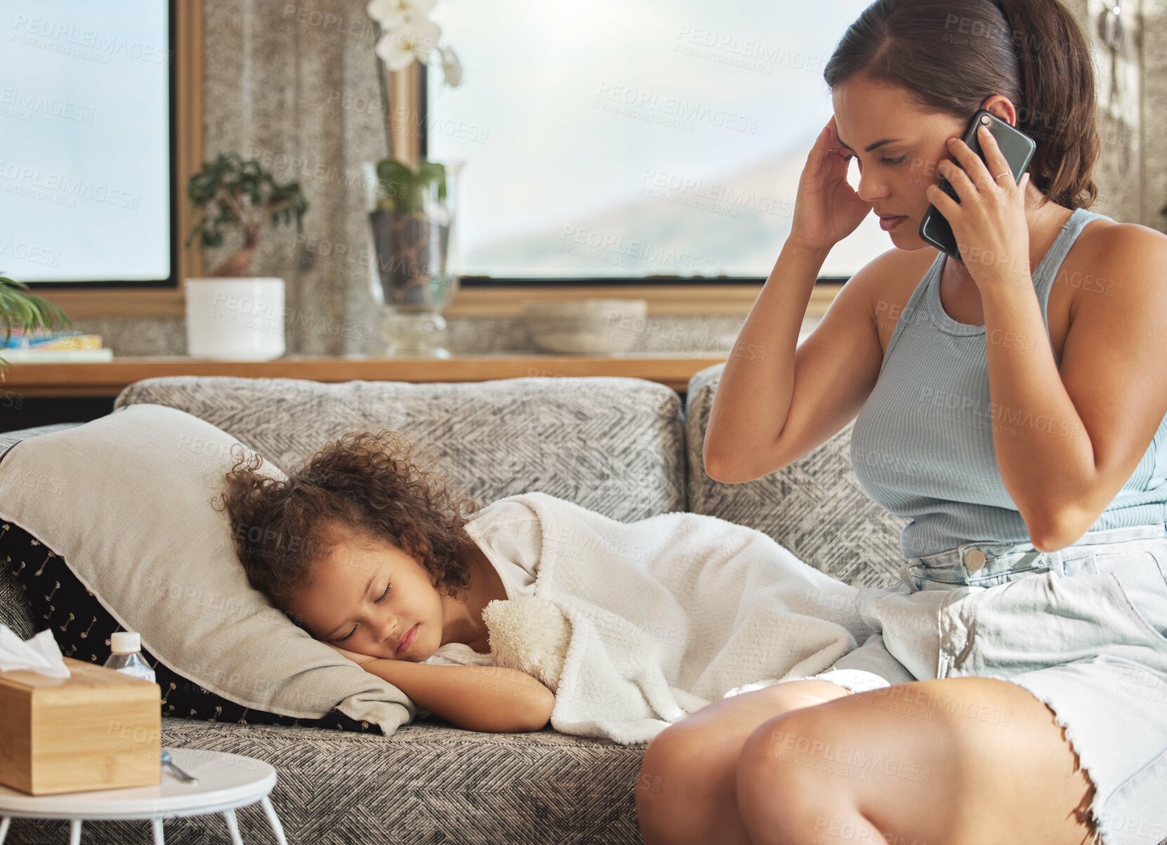 Buy stock photo Stressed mother on a call about sick child on a sofa, worried about her daughters health. Little girl with flu resting, sleeping and waiting for a home visit or checkup by a healthcare professional