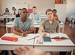 High school, students and boys listening in classroom of education, learning or knowledge. Highschool, studying and attention to teacher, academic lecture and teaching group for young people together