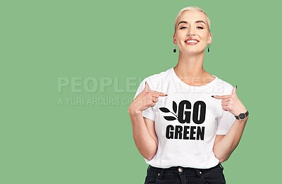 Buy stock photo Mockup, sustainable fashion and green background, woman with tshirt and space for eco friendly product placement. Sustainability, fashion and climate change influencer with smile and cotton clothes.