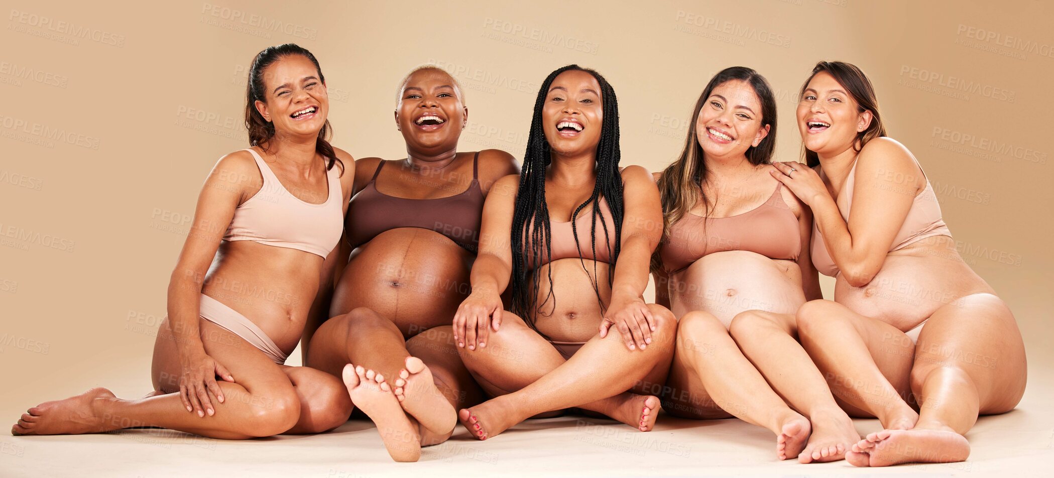 Buy stock photo Women group, studio portrait and pregnancy happiness with diversity, smile and solidarity by background. Support, pregnant friends and happy with excited face, future and sitting for hug by backdrop