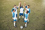 Men, football team and stretching in circle on field for training exercise and teamwork for muscle development. Group, soccer and start workout together for strong body, blood flow and stop injury