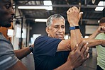 Elderly man, gym and stretching with personal trainer for health, wellness and training with smartwatch. Men, workout motivation and exercise together for goals, muscle development or body healthcare