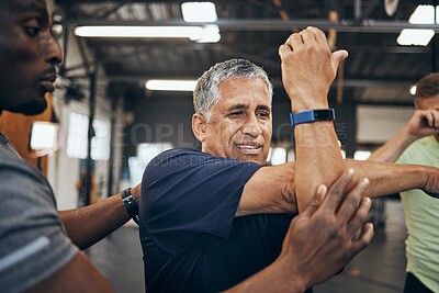 Buy stock photo Elderly man, gym and stretching with personal trainer for health, wellness and training with smartwatch. Men, workout motivation and exercise together for goals, muscle development or body healthcare