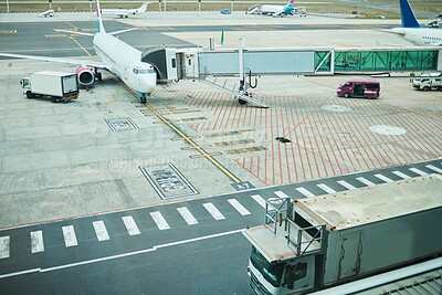 Buy stock photo Stationary airplane at airport, aircraft transport on tarmac and runway for international passenger travel driveway. Plane on ground, outdoor flight terminal and cargo carrier on aeroplane runway