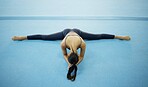 Above, stretching and woman doing gymnastics on the floor, fitness warmup and flexibility from yoga. Pilates, exercise and athlete gymnast doing a stretch routine to prepare for a performance