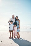 Vacation, beach and portrait of happy family together at the sea or ocean bonding for love, care and happiness. Happy, sun and parents with children or kids on to relax for peace on outdoor holiday