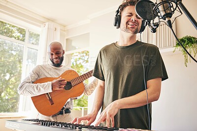 Buy stock photo Piano, microphone and friends singing with guitar in home studio together. Electric keyboard, acoustic instrument or recording for collaboration, creative music production and headphones of happy men
