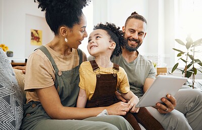 Buy stock photo Home, family and parents with a tablet, boy and connection with games, cartoon and relax. People, mother or father with their son, child or kid on a sofa, technology or social media with conversation